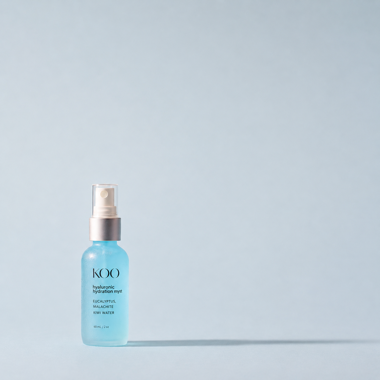 Dr. Koo Hyaluronic Hydration Myst, a 60 mL mineral-rich hydrating facial mist, shown against a calm pale-blue background.